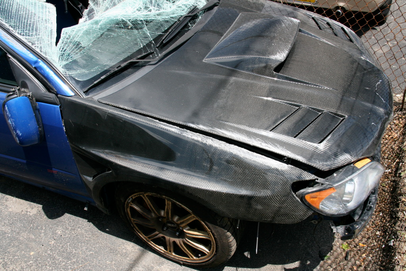 Illustration for article titled Subaru STI Hits Two Trees At Speed, Flips Twice, Everyone Survives!